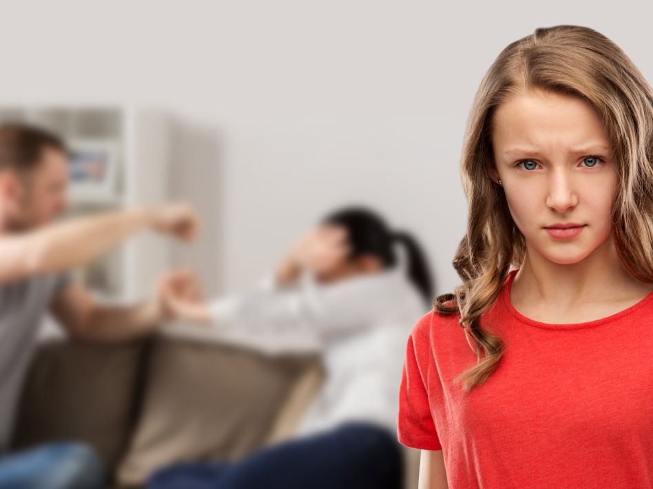 Child looking ahead while parents argue in background